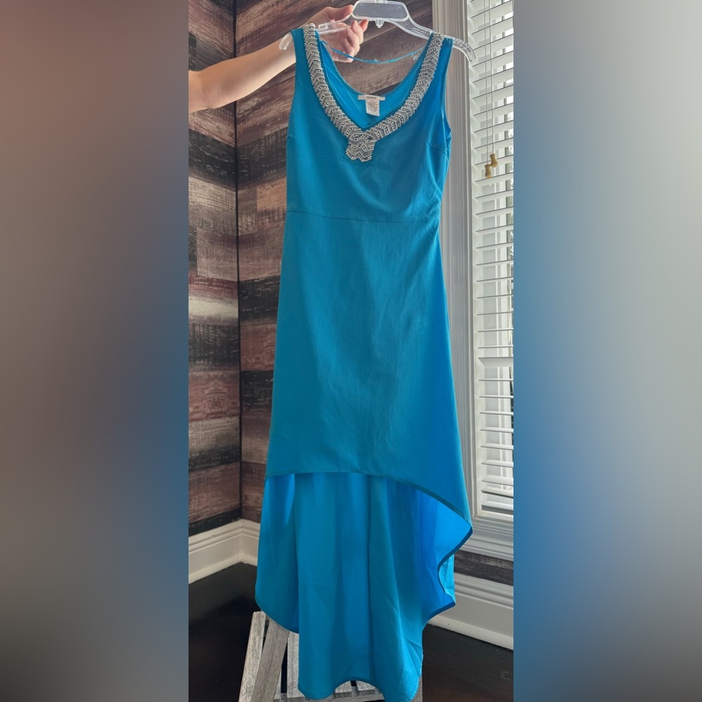 Turquoise dress high in the front lower in the back with beaded top